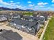 Aerial view of townhomes in a well-planned community, showcasing modern architecture and landscaping at 19593 W 93Rd Ln # E, Arvada, CO 80007