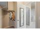 Functional walk-in closet with ample hanging space and easy access to the ensuite bathroom at 19593 W 93Rd Ln # E, Arvada, CO 80007
