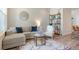 Well-decorated living room featuring a comfortable seating area and stylish accents at 19593 W 93Rd Ln # E, Arvada, CO 80007