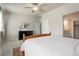 Serene bedroom with a ceiling fan, neutral decor, and an ensuite bathroom for added privacy at 19593 W 93Rd Ln # E, Arvada, CO 80007