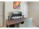 Cozy office space featuring a desk, monitor, speakers, and a comfortable chair for an ideal work from home environment at 19593 W 93Rd Ln # E, Arvada, CO 80007