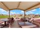 Outdoor picnic area featuring tables, chairs, playground, and scenic views of surrounding homes and greenery at 19593 W 93Rd Ln # E, Arvada, CO 80007