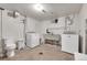 Unfinished basement with toilet, laundry hookups, and sink at 2990 Sheridan Blvd, Denver, CO 80214