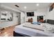 Basement bedroom with a queen bed and wood floors at 2990 Sheridan Blvd, Denver, CO 80214