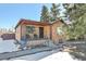 Brick ranch home with a covered porch and well-maintained landscaping at 2990 Sheridan Blvd, Denver, CO 80214