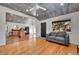 Open living room features hardwood floors and kitchen access at 2990 Sheridan Blvd, Denver, CO 80214