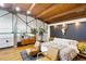 Stylish bedroom boasting wood floors, industrial ceiling, decor and modern furniture at 1203 24Th St, Denver, CO 80205