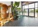 Welcoming entryway with custom wood bench, plants, and an aquarium, with views of the city skyline at 1203 24Th St, Denver, CO 80205