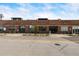 A brick building is set back from the street with a sidewalk in front at 1203 24Th St, Denver, CO 80205