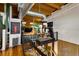 A bright multi-level gym features exposed ductwork, a weight rack, and exercise equipment at 1203 24Th St, Denver, CO 80205