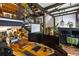 Open-concept home office with a staircase, exposed beams, plants and plenty of sunlight at 1203 24Th St, Denver, CO 80205