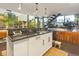 Contemporary kitchen with black countertops, white cabinets, and an open layout to the second floor at 1203 24Th St, Denver, CO 80205