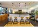 Eat-in kitchen with modern appliances and counter seating at 1203 24Th St, Denver, CO 80205
