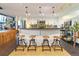 Modern kitchen with stainless steel appliances, bar seating, and pendant lighting at 1203 24Th St, Denver, CO 80205