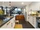 Modern kitchen featuring black granite countertops, white cabinets, and stainless steel appliances at 1203 24Th St, Denver, CO 80205