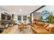 Bright living room with a cozy leather sectional, unique coffee table, and modern decor at 1203 24Th St, Denver, CO 80205