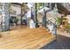 Open living area with hardwood floors, wrought iron staircase, and statue at 1203 24Th St, Denver, CO 80205