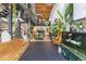Open living space with wrought iron staircase, herringbone wood floors, concrete tile and a fish tank at 1203 24Th St, Denver, CO 80205