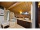 Bright bathroom with tile floors, modern vanity, glass shower, and a wood-beam ceiling at 1203 24Th St, Denver, CO 80205