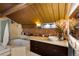 Bright bathroom with tile floors, modern vanity, glass shower, and a wood-beam ceiling at 1203 24Th St, Denver, CO 80205