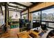 Office with city views, desk with monitors, greenery and exposed brick at 1203 24Th St, Denver, CO 80205
