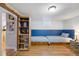 This bedroom features two built-in beds with drawers, and a built in bookshelf for displaying books and toys at 1359 Chambers Rd, Aurora, CO 80011