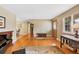 Warm and inviting living room with hardwood floors, a piano, and lots of natural light at 1359 Chambers Rd, Aurora, CO 80011