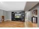 Relaxing living room with a TV, shelving, and a nearby staircase, perfect for entertaining or relaxing at 1359 Chambers Rd, Aurora, CO 80011