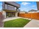 Backyard featuring artificial grass, concrete patio, and contemporary home design, perfect for outdoor enjoyment at 2223 W 34Th Ave, Denver, CO 80211