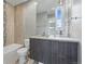 Modern bathroom with a large mirror, vanity, and shower at 2223 W 34Th Ave, Denver, CO 80211