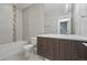 Modern bathroom with stylish vanity, tiled shower-tub combo, and elegant fixtures at 2223 W 34Th Ave, Denver, CO 80211