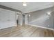 Spacious bedroom with light wood floors, closet, and neutral gray walls at 2223 W 34Th Ave, Denver, CO 80211