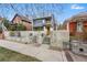 Modern exterior featuring a concrete wall, xeriscaping, and architectural design with a yellow trim at 2223 W 34Th Ave, Denver, CO 80211