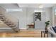 Hallway with wooden stairs and gray cabinet, providing extra storage space at 2223 W 34Th Ave, Denver, CO 80211
