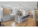 Bright, modern kitchen with sleek cabinets, stainless steel appliances, and an island with seating at 2223 W 34Th Ave, Denver, CO 80211