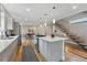 Modern kitchen featuring a large island with pendant lighting and stainless steel appliances at 2223 W 34Th Ave, Denver, CO 80211