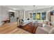 Stylish living room with a patterned rug, modern chandelier, and sliding glass doors to the backyard at 2223 W 34Th Ave, Denver, CO 80211