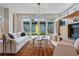 Inviting living room featuring modern furnishings, a fireplace, and sliding glass doors to the outdoors at 2223 W 34Th Ave, Denver, CO 80211