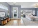Bright primary bedroom with wood floors, and access to a private balcony at 2223 W 34Th Ave, Denver, CO 80211
