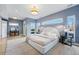 Bright main bedroom features modern lighting fixtures, hardwood floors, and large windows offering city views at 2223 W 34Th Ave, Denver, CO 80211