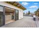 Expansive rooftop deck with wet bar, featuring sleek sliding doors for indoor-outdoor living and neighborhood views at 2223 W 34Th Ave, Denver, CO 80211