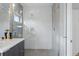 Contemporary bathroom featuring a glass shower, decorative tiling, and sleek vanity at 2223 W 34Th Ave, Denver, CO 80211