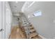 Contemporary staircase features metal railings, hardwood steps, and ample natural light at 2223 W 34Th Ave, Denver, CO 80211