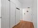 Bright hallway featuring wood floors, closet and paneled doors at 1555 California St # 414, Denver, CO 80202