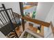 Lofted interior view showcasing the open layout, spiral staircase, exposed beams, and eclectic design elements at 1555 California St # 414, Denver, CO 80202