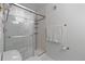 Shower with glass enclosure, white tile, and chrome hardware at 1555 California St # 414, Denver, CO 80202