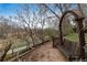Backyard features a wooden swing bench overlooking scenic greenery at 7676 S Olive Cir, Centennial, CO 80112