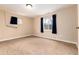 Finished basement bedroom with carpet and a large window at 7676 S Olive Cir, Centennial, CO 80112