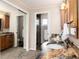 Beautiful bathroom with granite counters, dual sinks, a glass shower, and a mirrored closet at 7676 S Olive Cir, Centennial, CO 80112