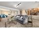 The carpeted living room provides generous open space and allows access to the dining area at 7676 S Olive Cir, Centennial, CO 80112
